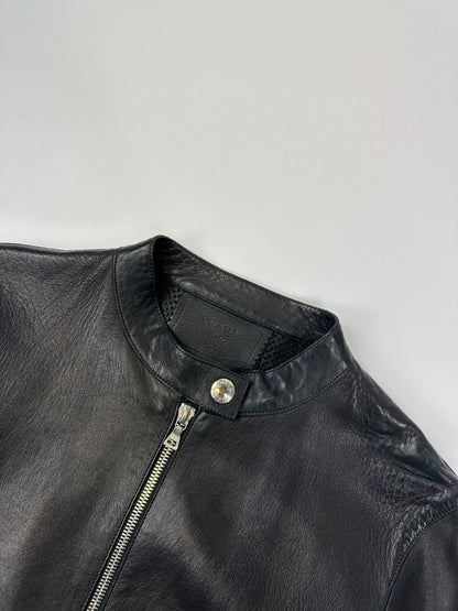Prada black perforated leather jacket with subtle logo detailing and minimalist design.