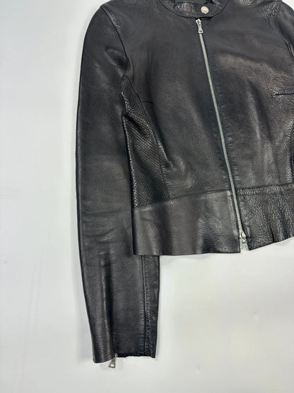 Prada black perforated leather jacket with subtle logo detailing and minimalist design.
