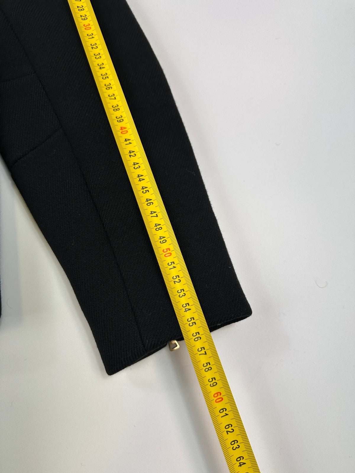 Prada black wool and leather jacket with biker-style detailing and logo accents.