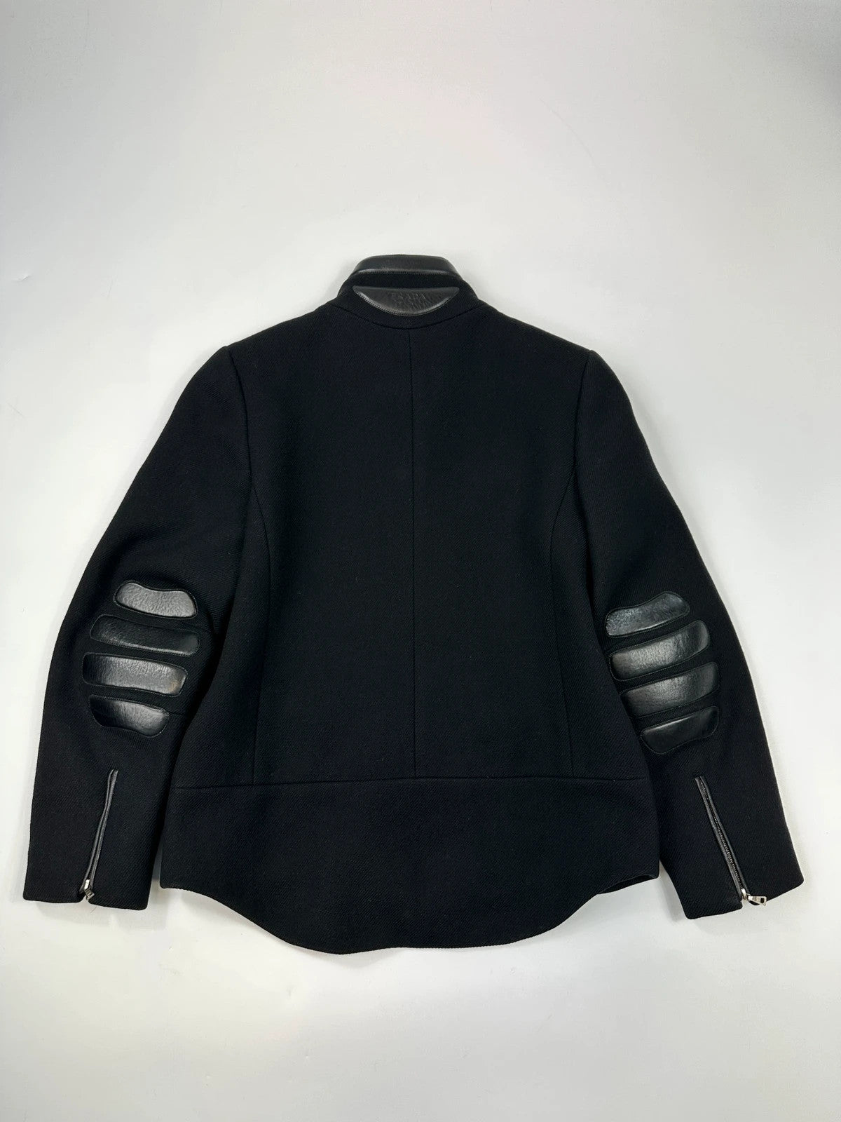 Prada black wool and leather jacket with biker-style detailing and logo accents.