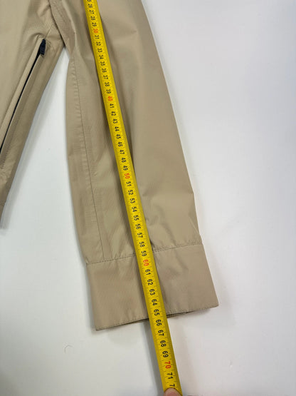 Prada beige Gore-Tex jacket packable into pocket, features logo and nylon material.