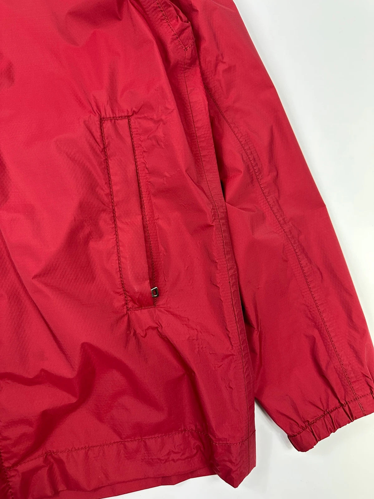 Prada red Gore-Tex jacket with logo detail, vintage Autumn-Winter 2003 collection.