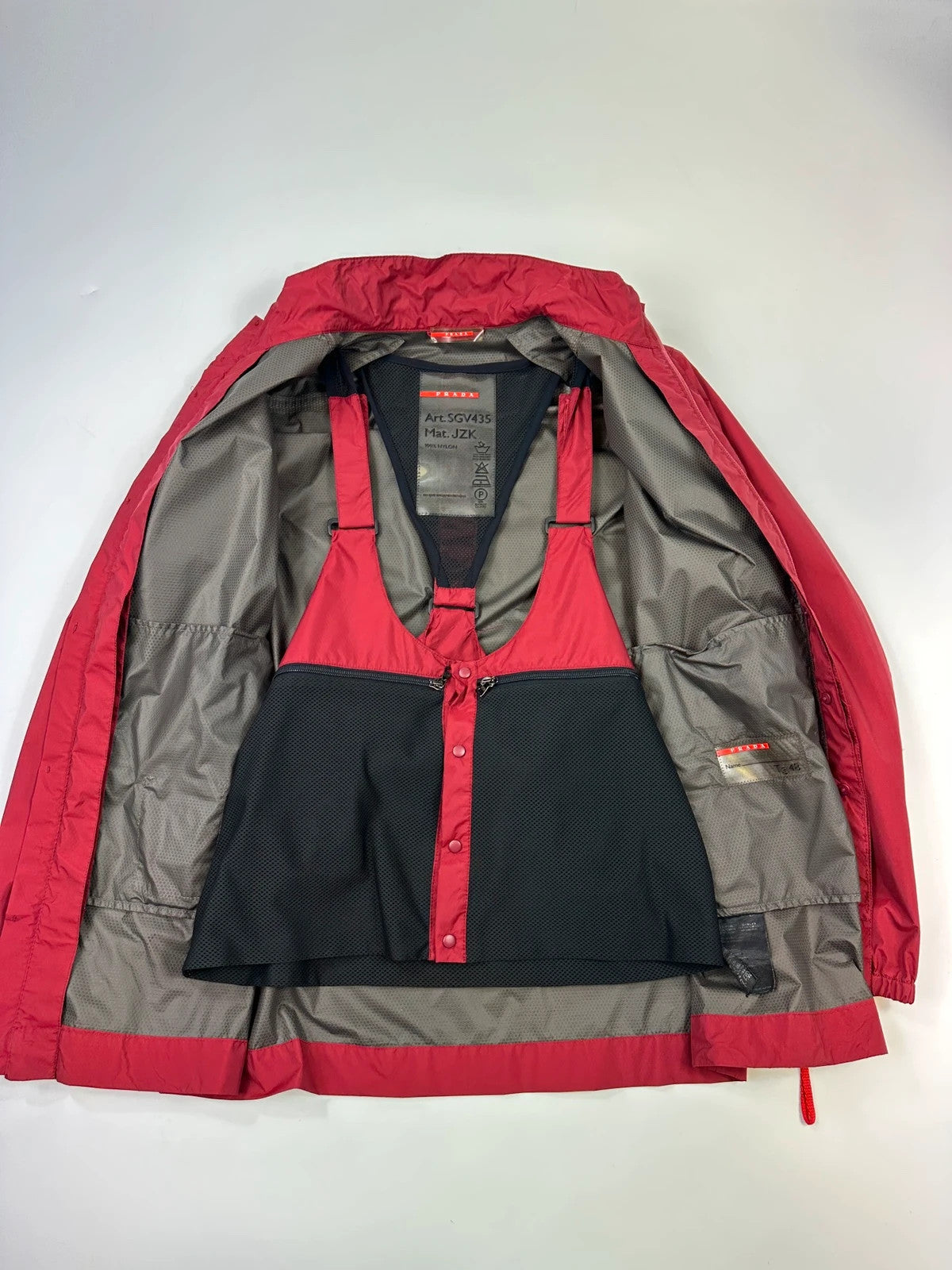 Prada red Gore-Tex jacket with logo detail, vintage Autumn-Winter 2003 collection.