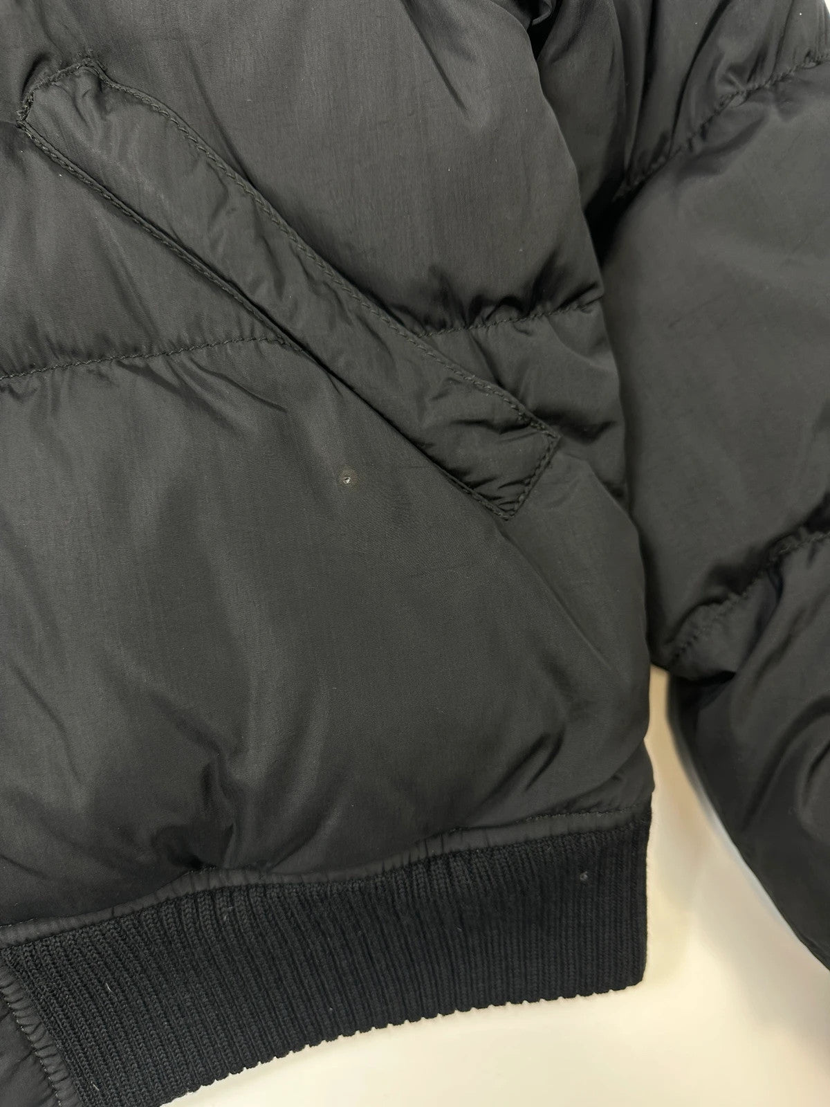 Prada black cropped bomber puffer jacket with logo detailing and vintage 90s design.