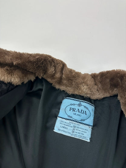 Prada black cropped bomber puffer jacket with logo detailing and vintage 90s design.