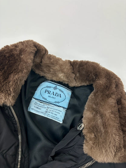 Prada black cropped bomber puffer jacket with logo detailing and vintage 90s design.