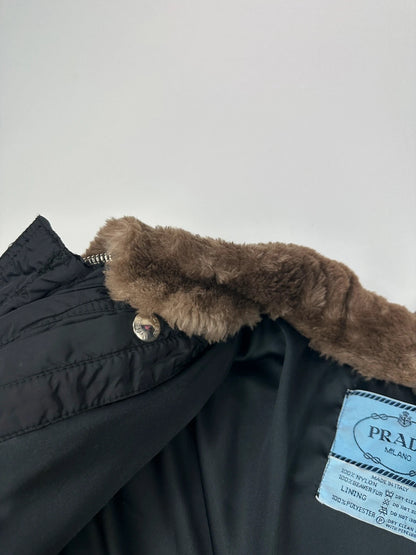 Prada black cropped bomber puffer jacket with logo detailing and vintage 90s design.