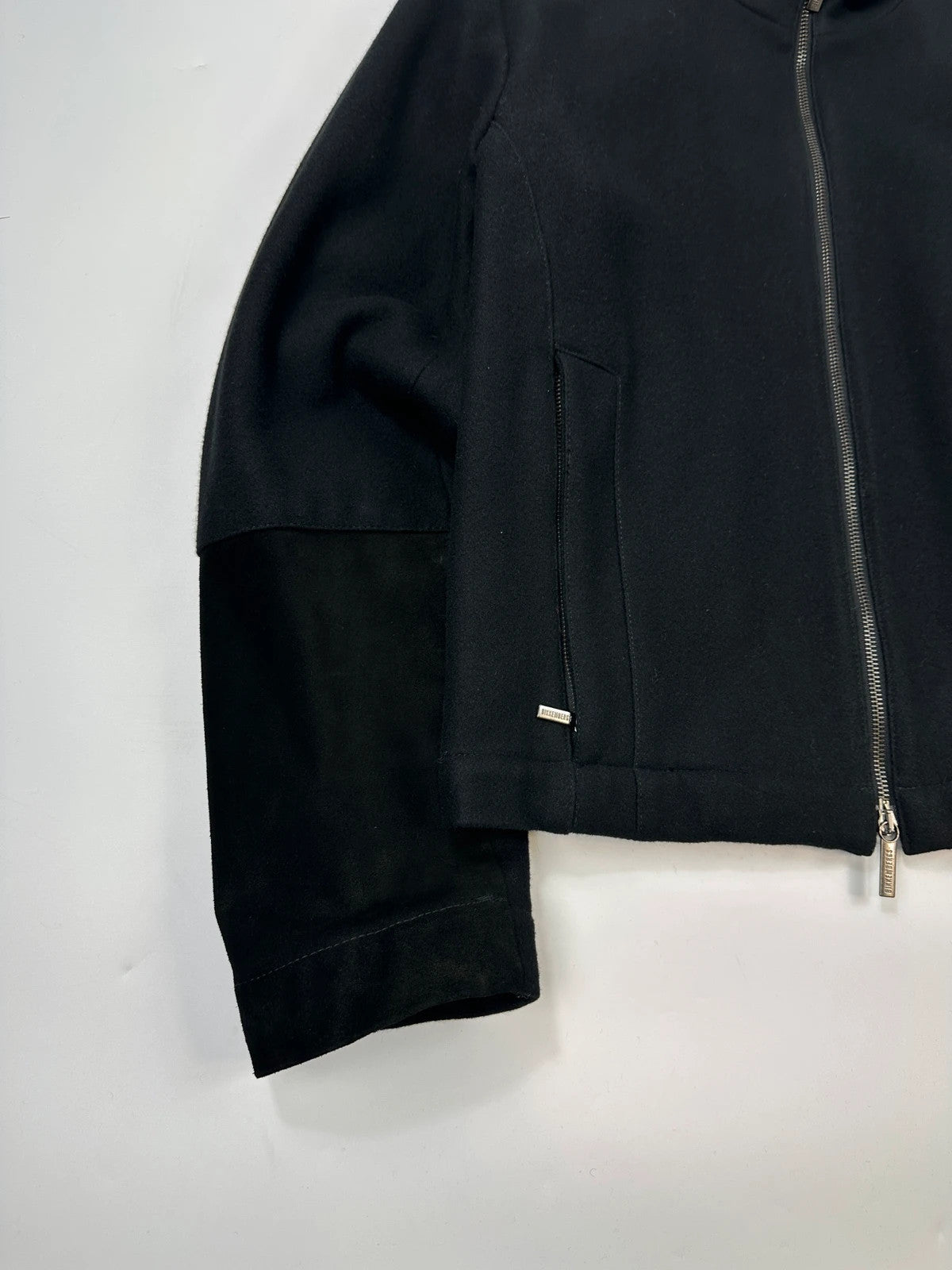 Bikkembergs black wool and leather jacket with minimalist design and subtle logo details.