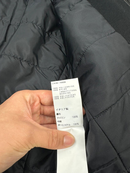 Bikkembergs black wool and leather jacket with minimalist design and subtle logo details.