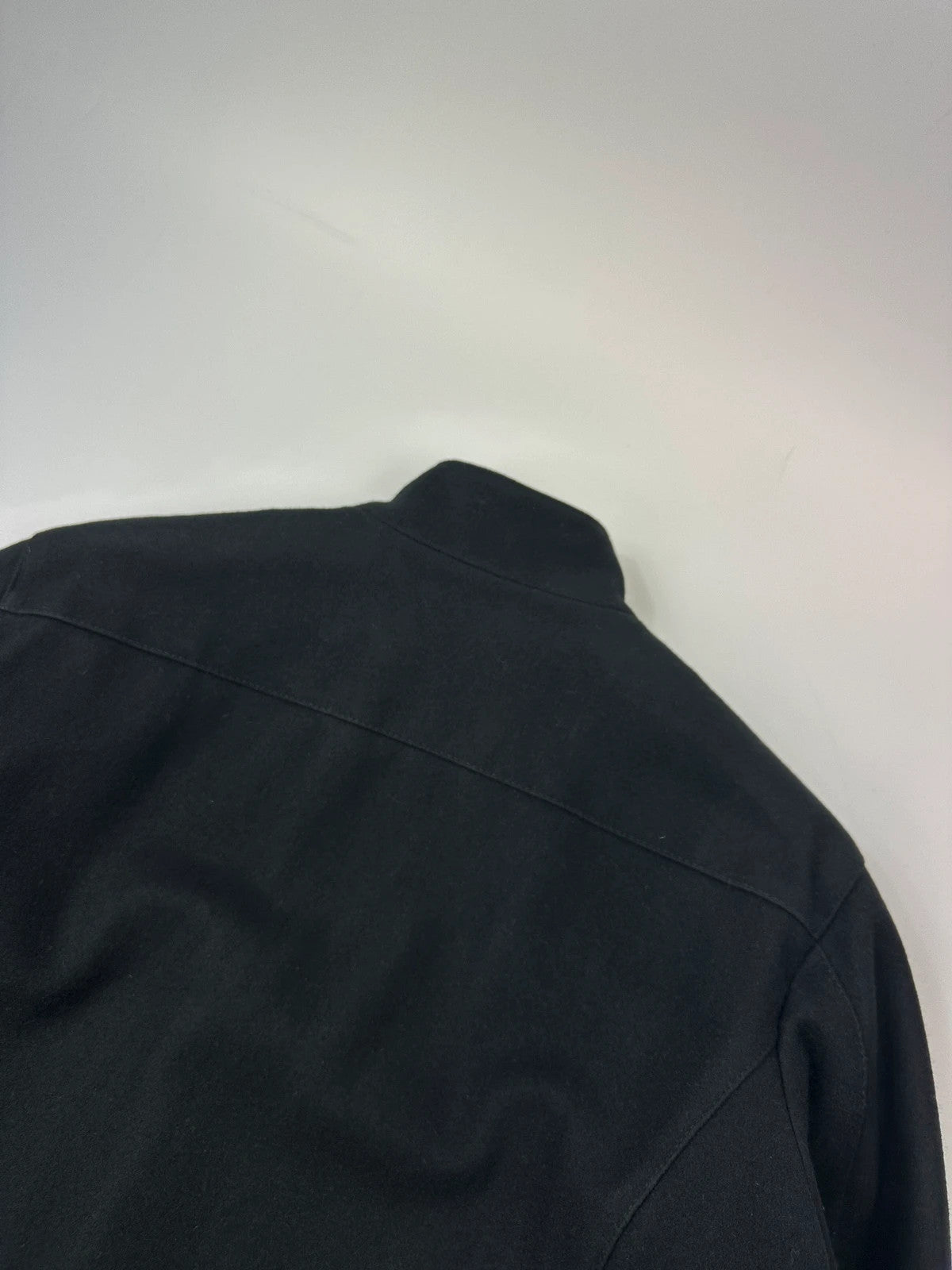 Bikkembergs black wool and leather jacket with minimalist design and subtle logo details.