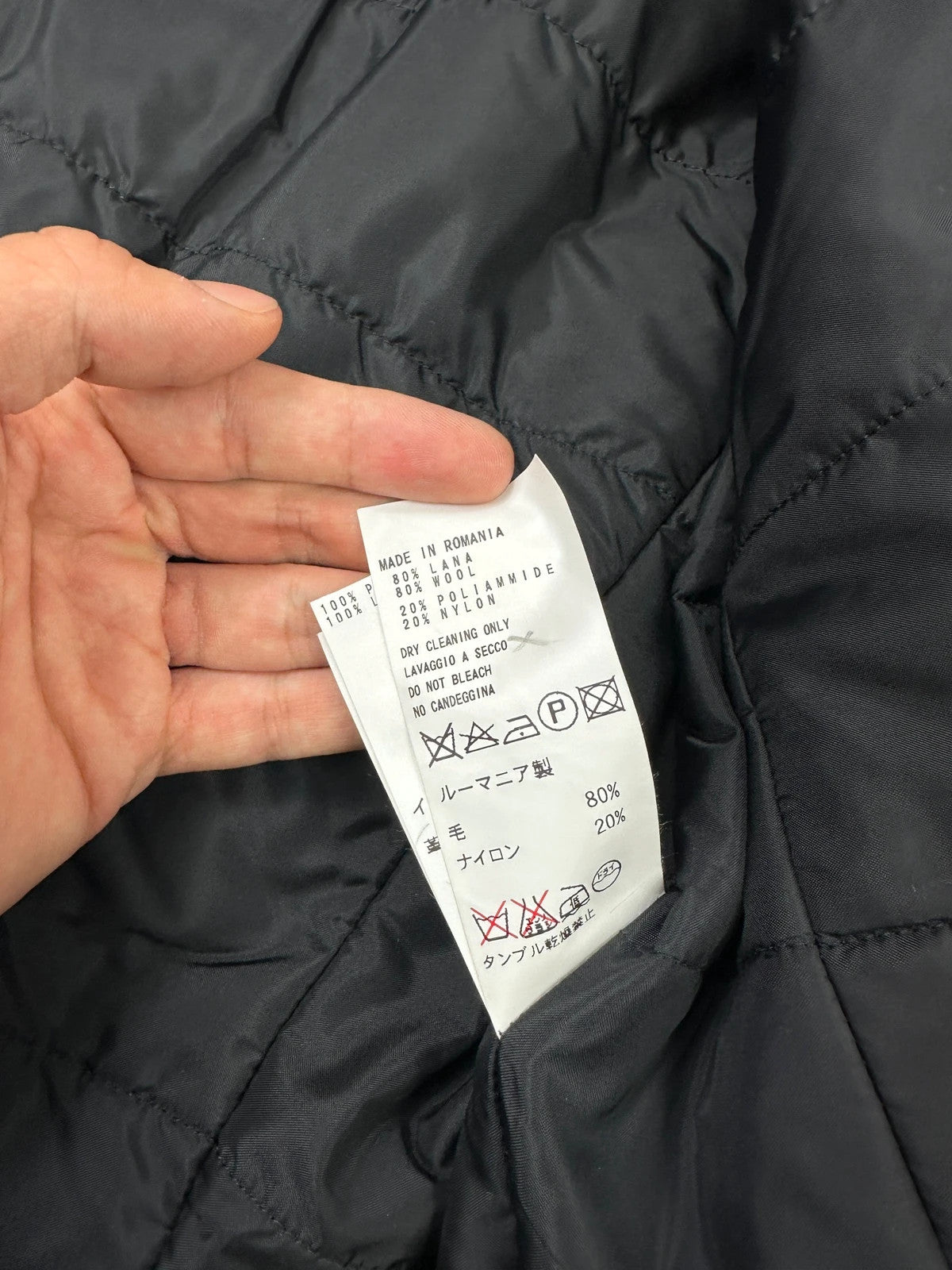 Bikkembergs black wool and leather jacket with minimalist design and subtle logo details.