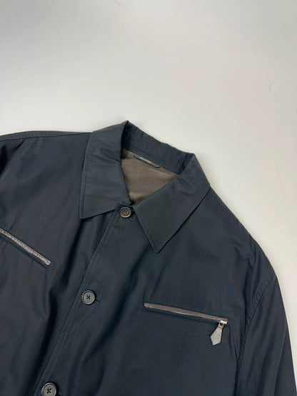 Hermès brown and navy jacket with leather straps and buttons, vintage 2000s design.