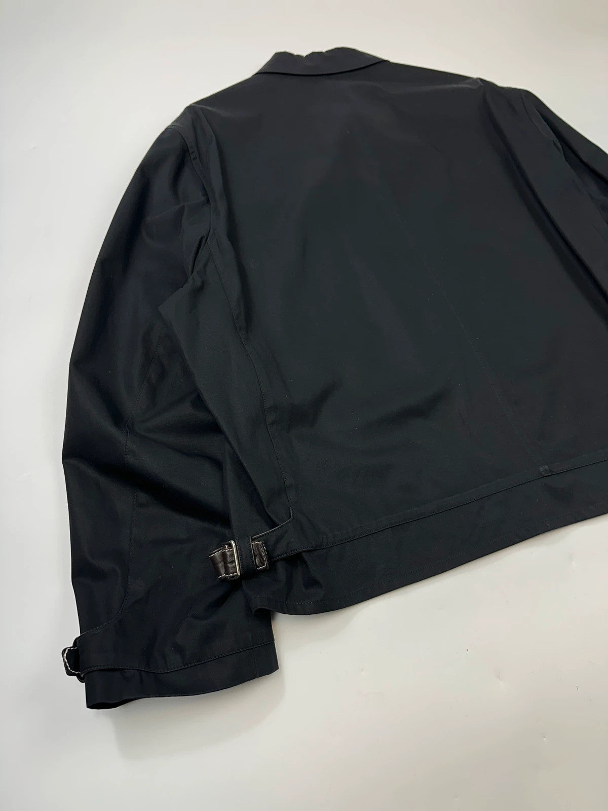 Hermès brown and navy jacket with leather straps and buttons, vintage 2000s design.