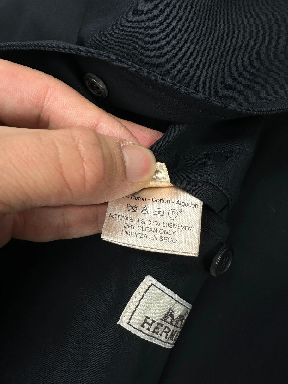 Hermès brown and navy jacket with leather straps and buttons, vintage 2000s design.