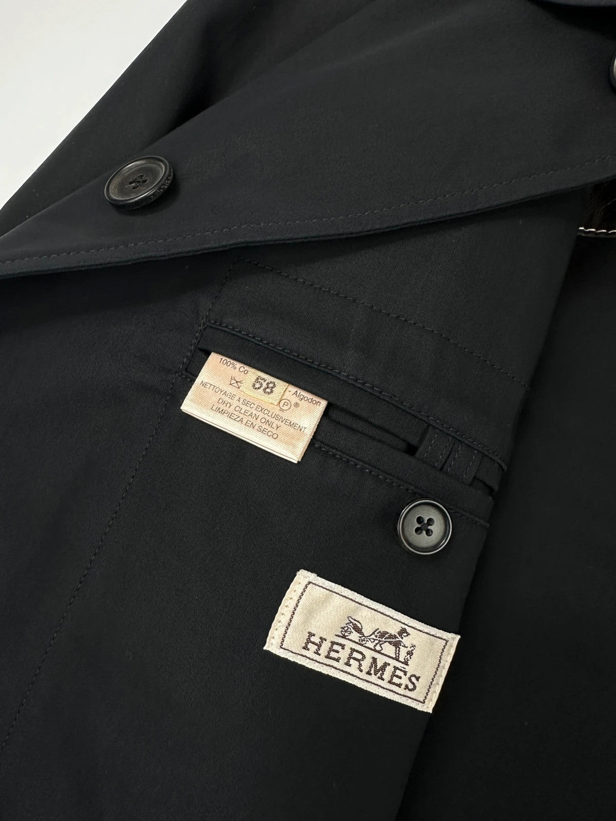 Hermès brown and navy jacket with leather straps and buttons, vintage 2000s design.