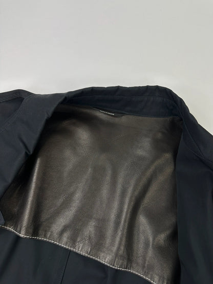 Hermès brown and navy jacket with leather straps and buttons, vintage 2000s design.