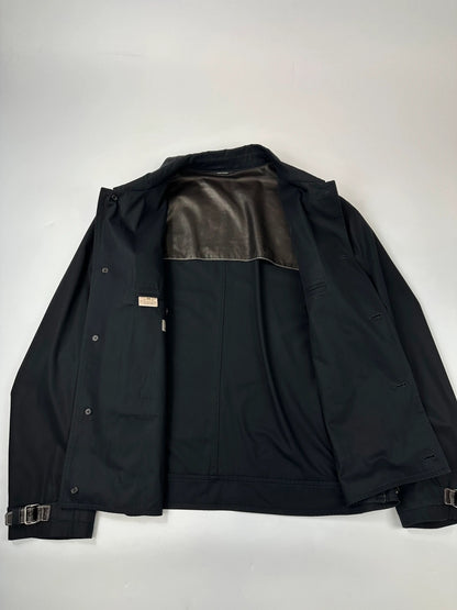 Hermès brown and navy jacket with leather straps and buttons, vintage 2000s design.