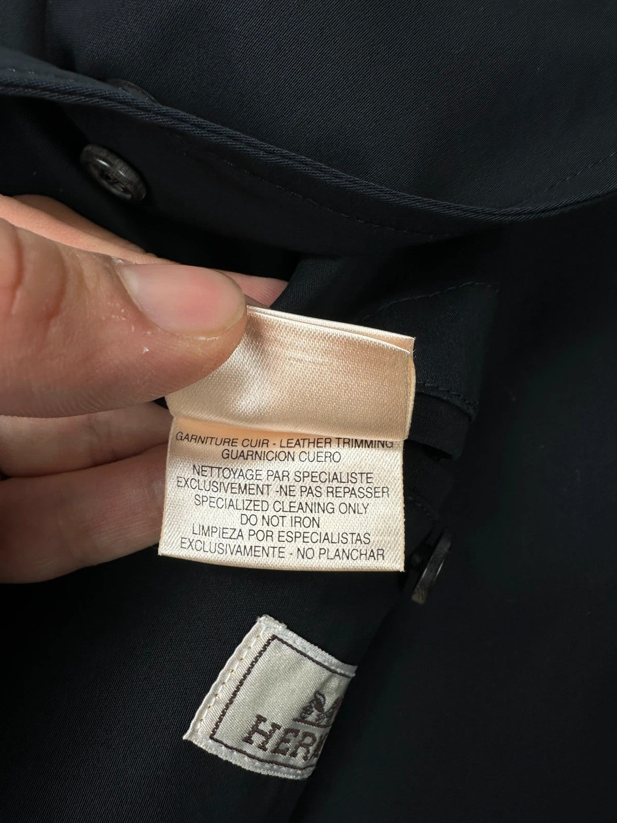 Hermès brown and navy jacket with leather straps and buttons, vintage 2000s design.