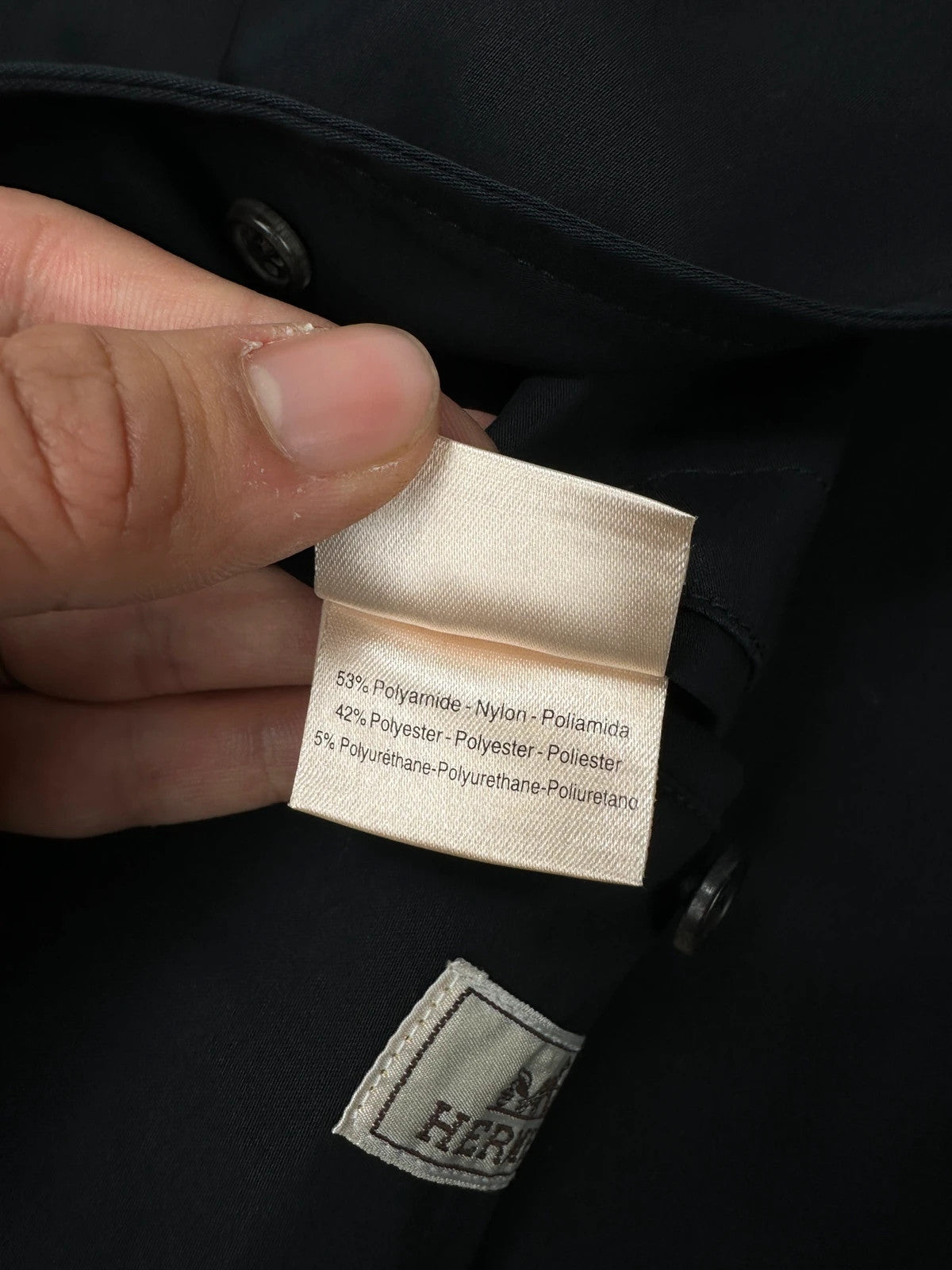 Hermès brown and navy jacket with leather straps and buttons, vintage 2000s design.
