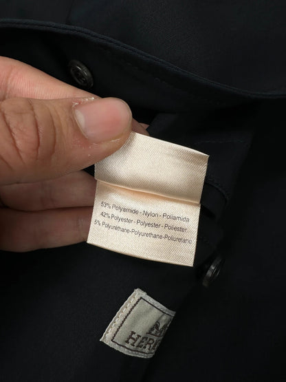Hermès brown and navy jacket with leather straps and buttons, vintage 2000s design.
