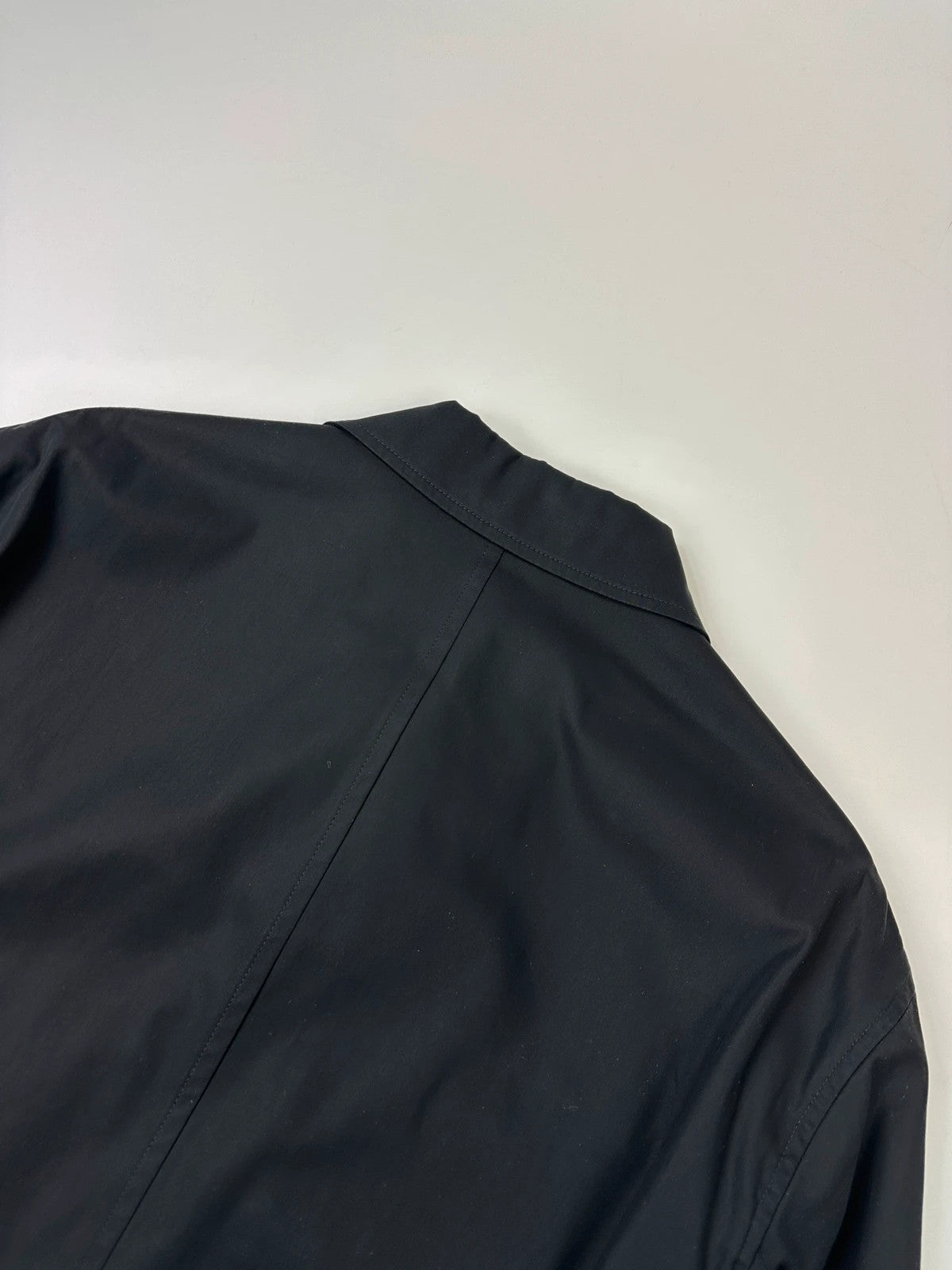 Hermès brown and navy jacket with leather straps and buttons, vintage 2000s design.