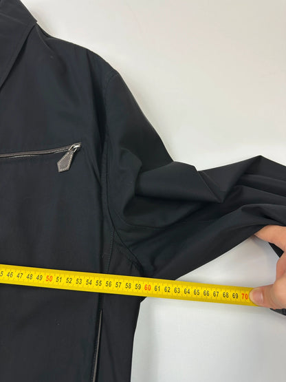 Hermès brown and navy jacket with leather straps and buttons, vintage 2000s design.