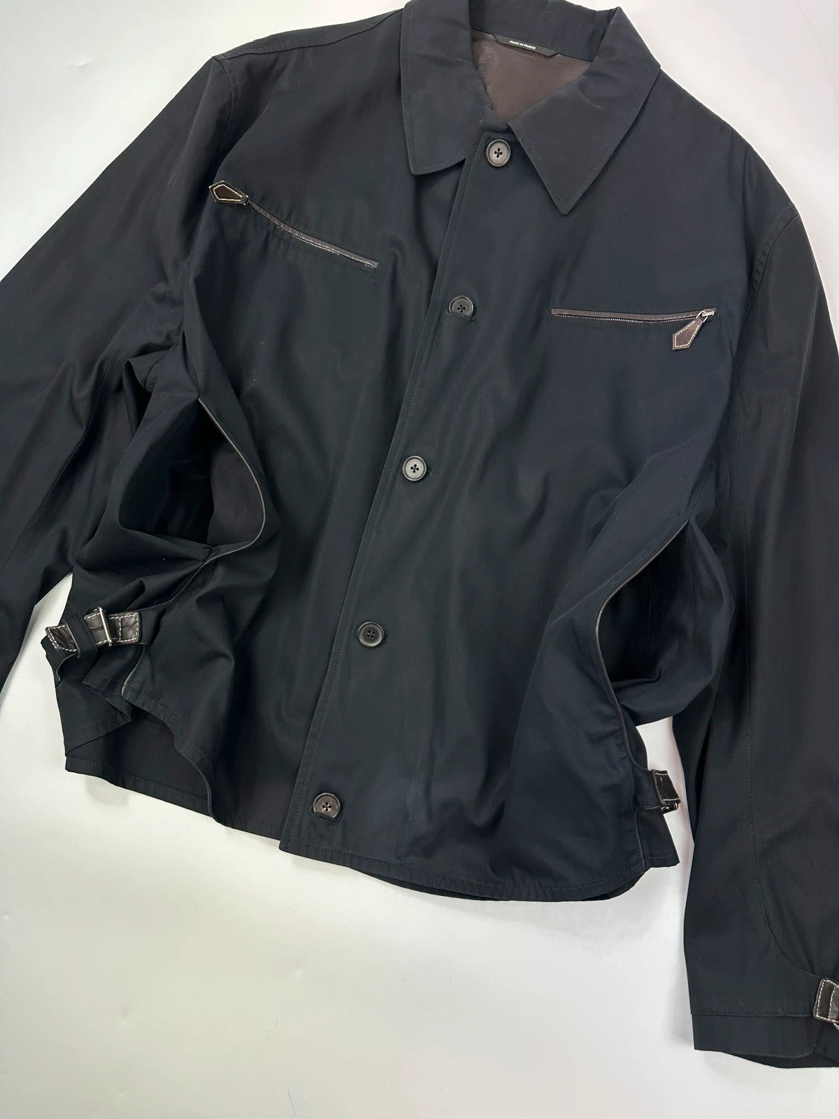 Hermès brown and navy jacket with leather straps and buttons, vintage 2000s design.