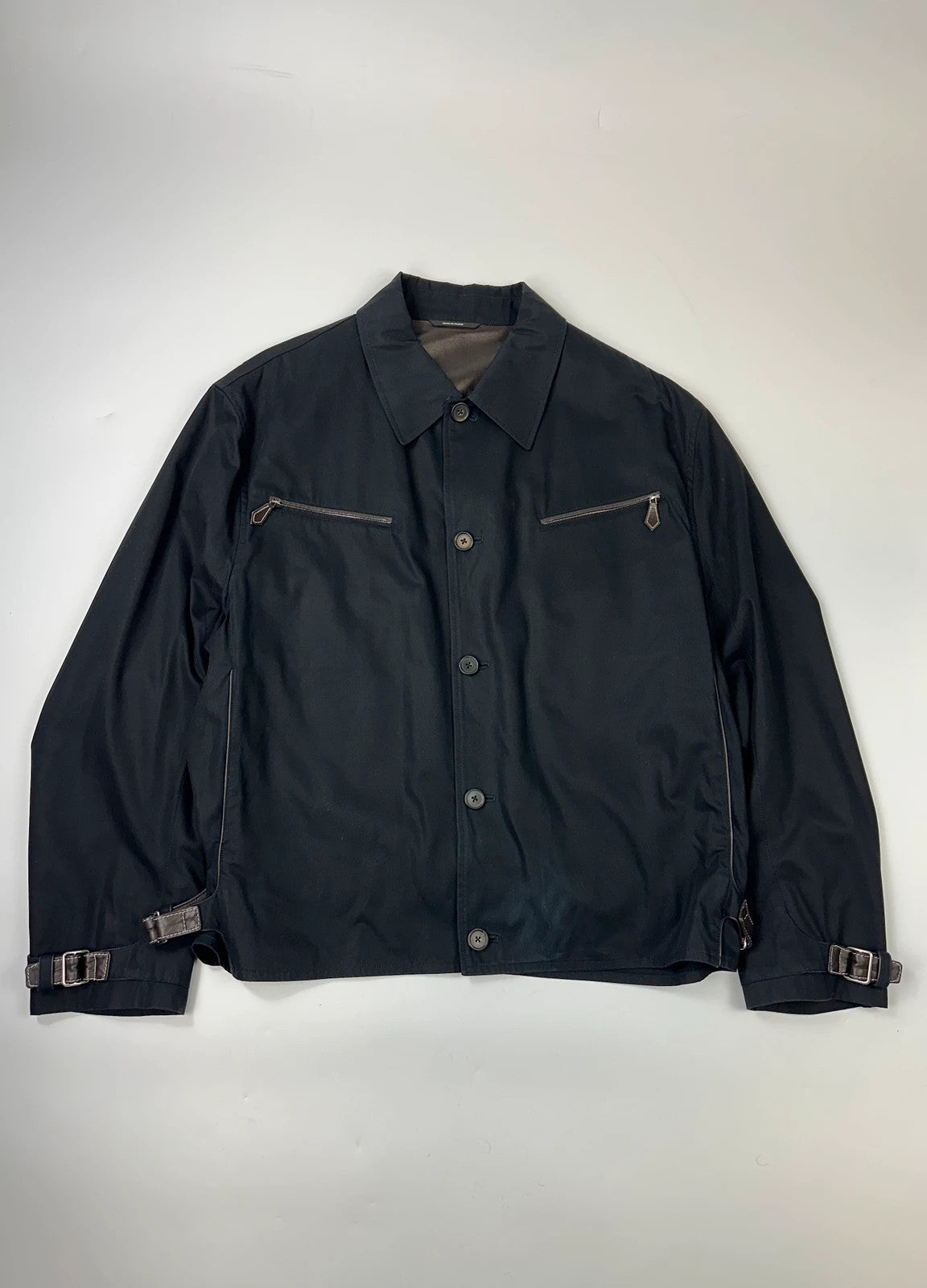 Hermès brown and navy jacket with leather straps and buttons, vintage 2000s design.