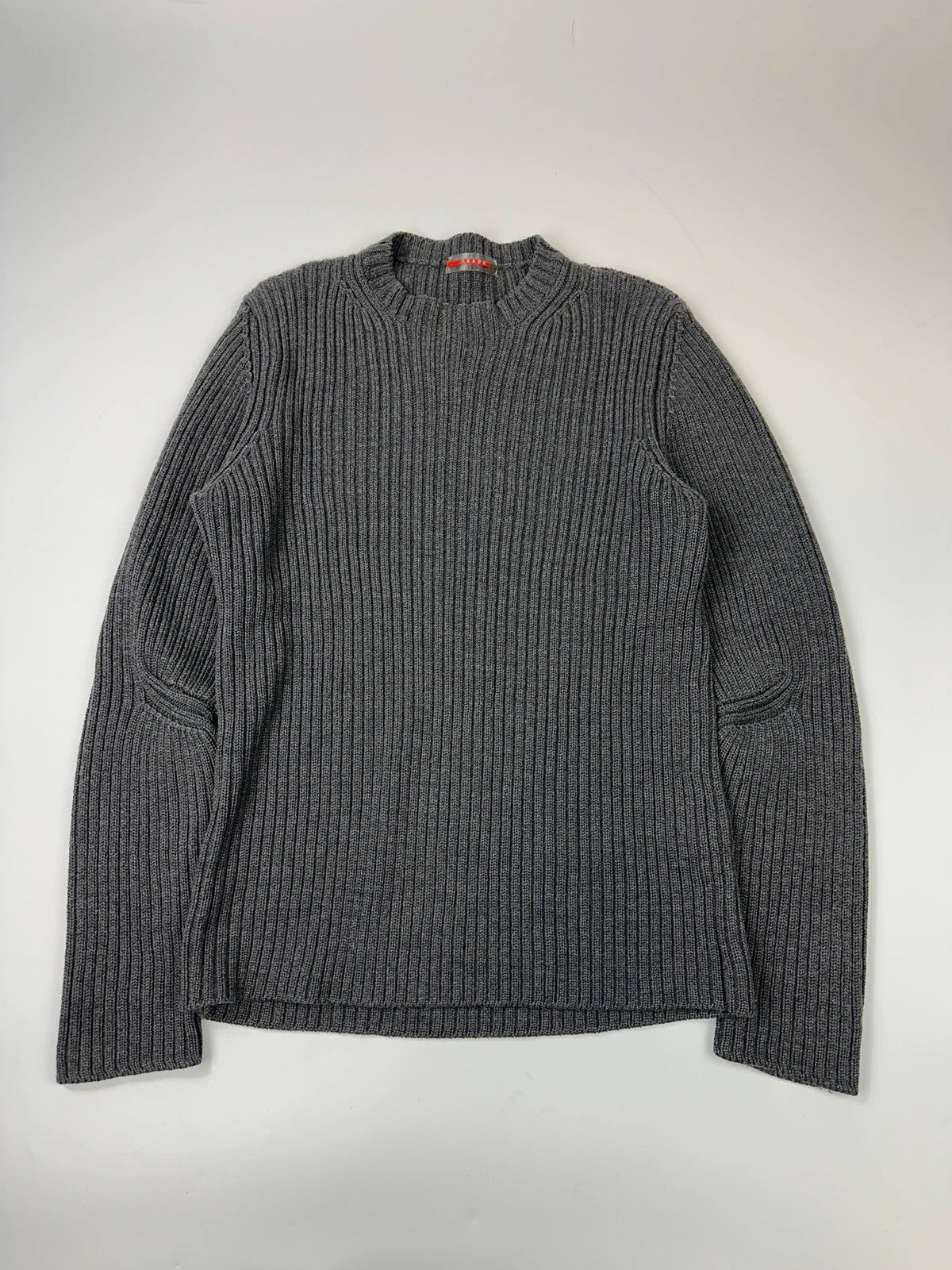 Prada grey ribbed wool knit sweater with elbow seam detailing from FW2004 collection.