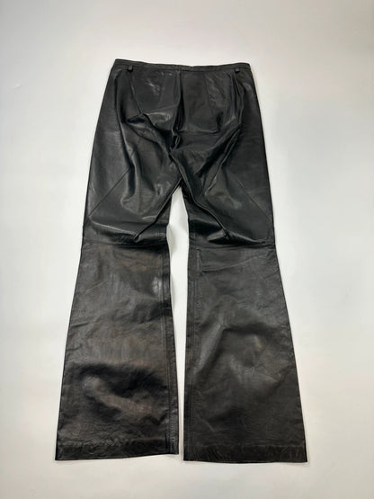 Marithé François Girbaud black flared leather-look trousers with soft texture and vintage design.