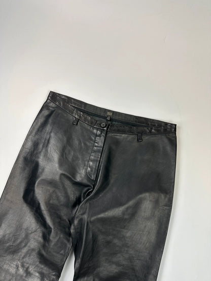 Marithé François Girbaud black flared leather-look trousers with soft texture and vintage design.