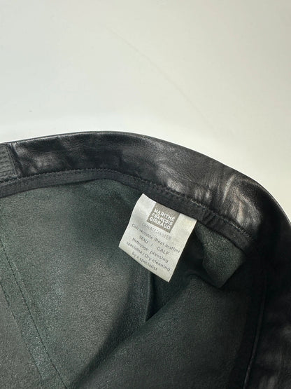 Marithé François Girbaud black flared leather-look trousers with soft texture and vintage design.