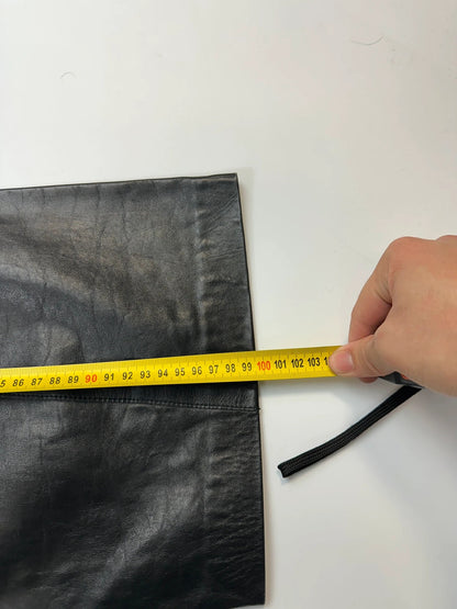 Marithé François Girbaud black flared leather-look trousers with soft texture and vintage design.