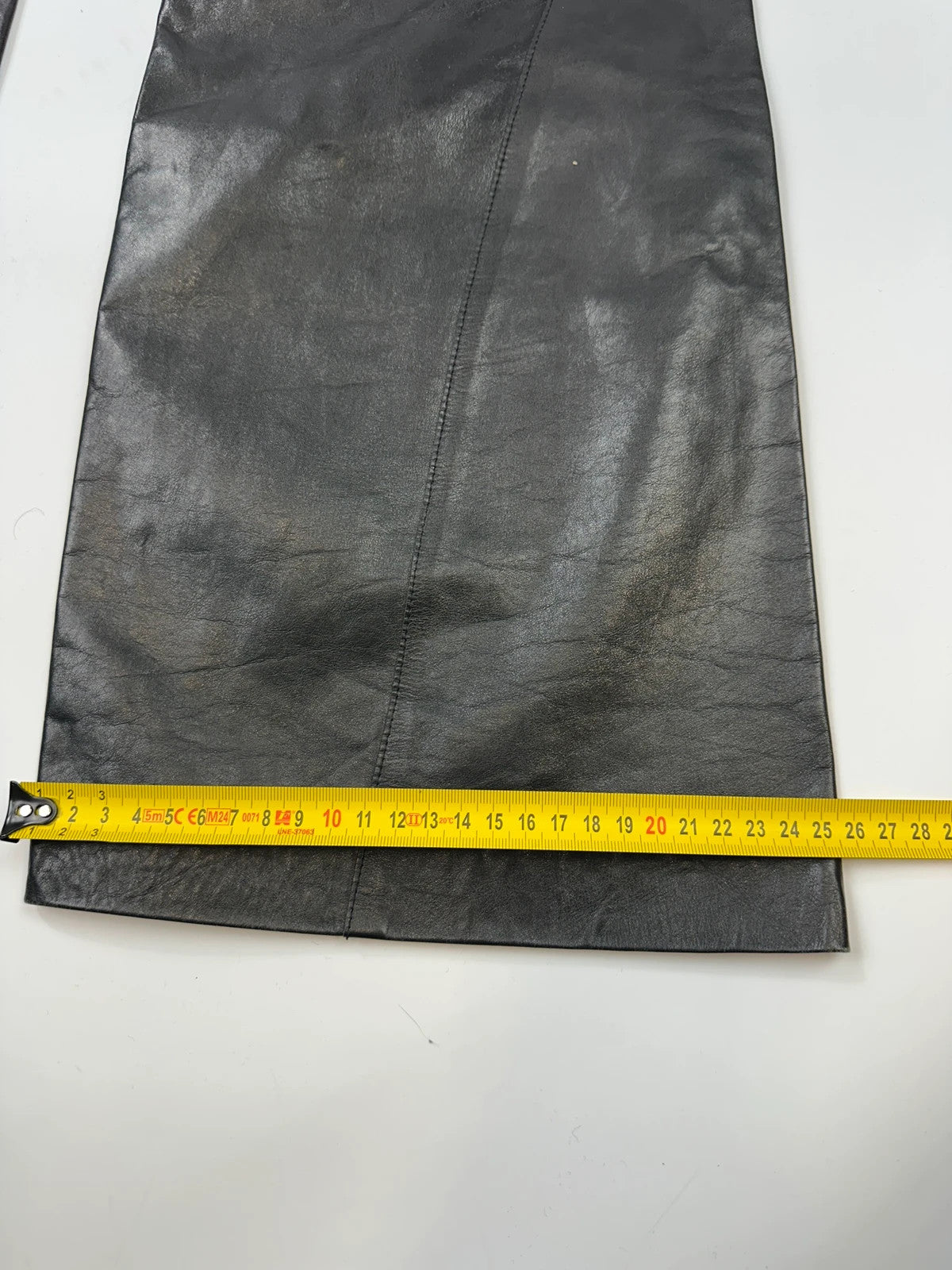 Marithé François Girbaud black flared leather-look trousers with soft texture and vintage design.