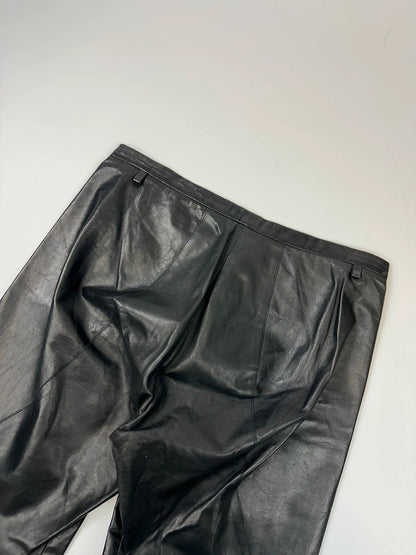 Marithé François Girbaud black flared leather-look trousers with soft texture and vintage design.
