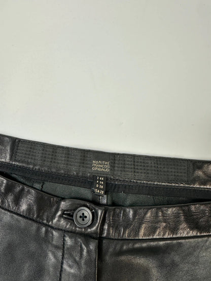 Marithé François Girbaud black flared leather-look trousers with soft texture and vintage design.