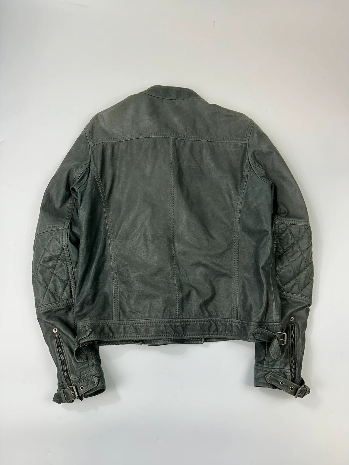 John Galliano khaki green leather jacket with side zip and soft texture.