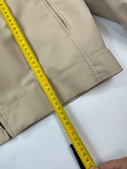 Prada beige Gore-Tex nylon jacket with logo detail and minimalist design.