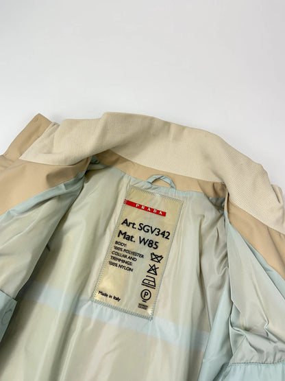 Prada beige Gore-Tex nylon jacket with logo detail and minimalist design.