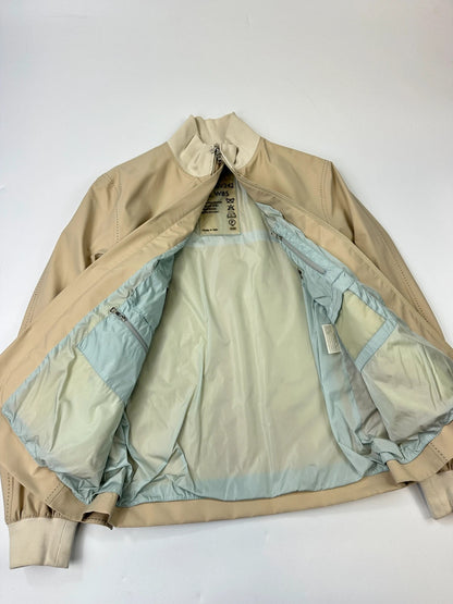 Prada beige Gore-Tex nylon jacket with logo detail and minimalist design.