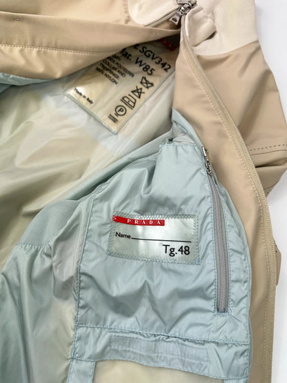 Prada beige Gore-Tex nylon jacket with logo detail and minimalist design.