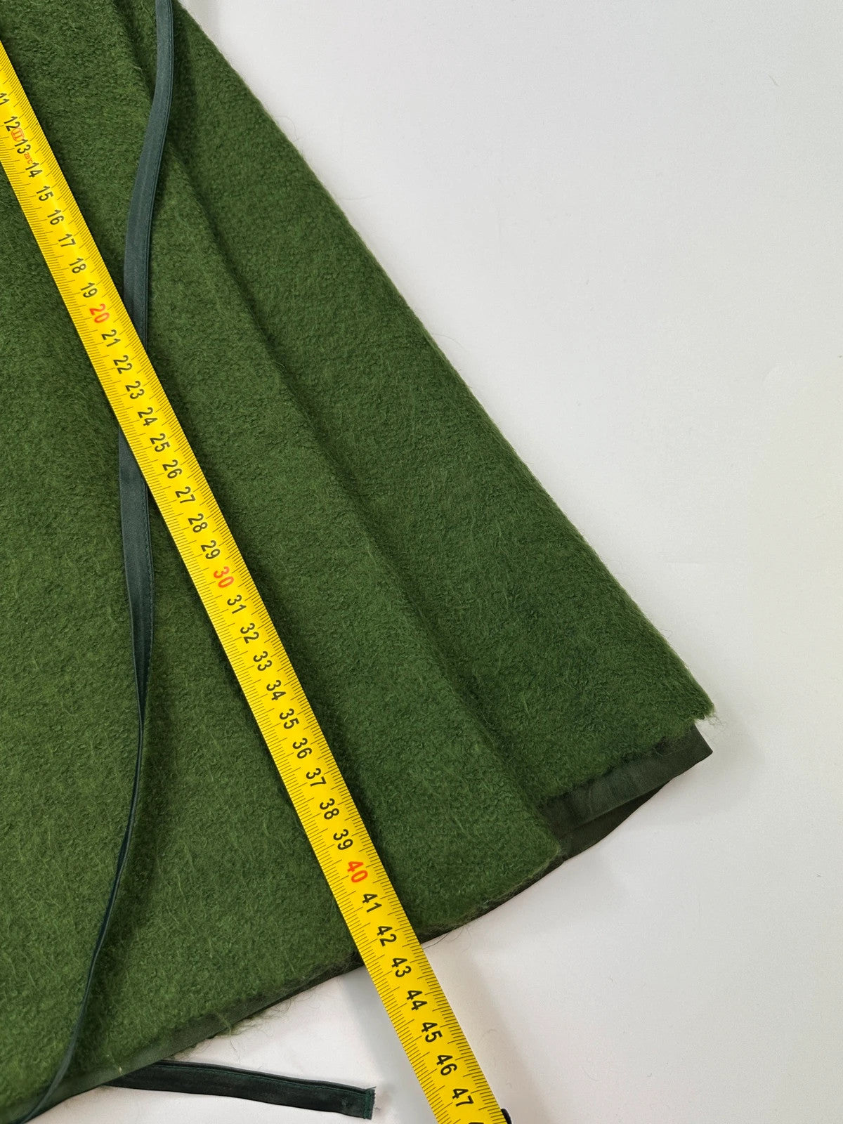 Kenzo green mohair skirt suit set with adjustable wrap skirt and logo detail.