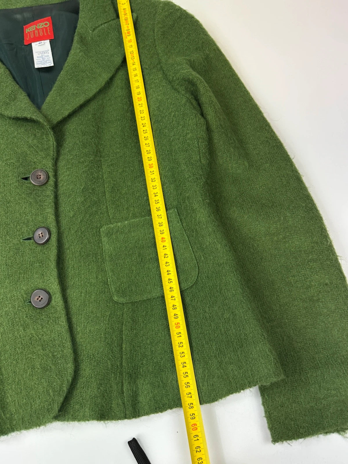 Kenzo green mohair skirt suit set with adjustable wrap skirt and logo detail.