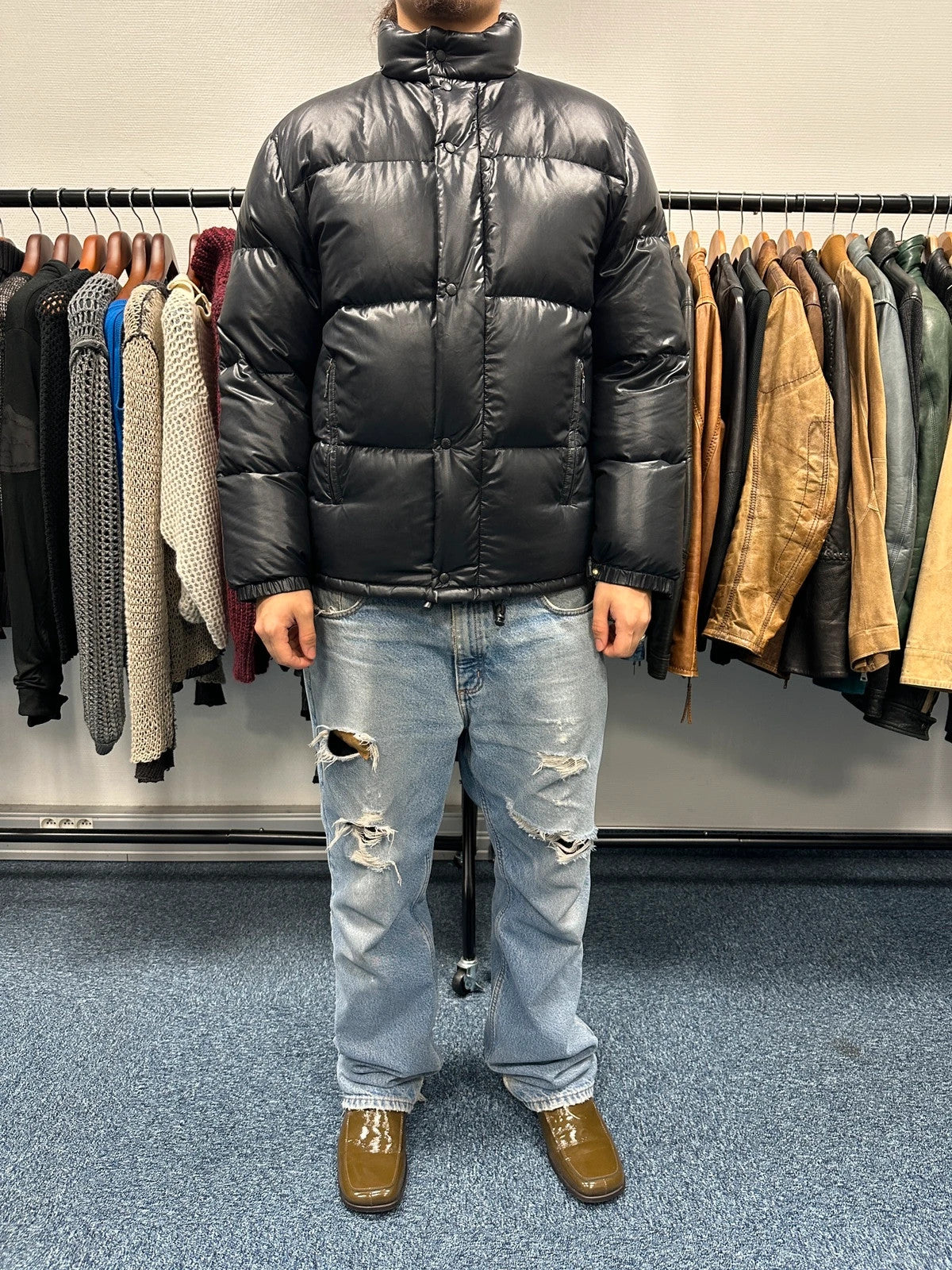 Moncler black nylon hooded puffer jacket with vintage logo and down filling.