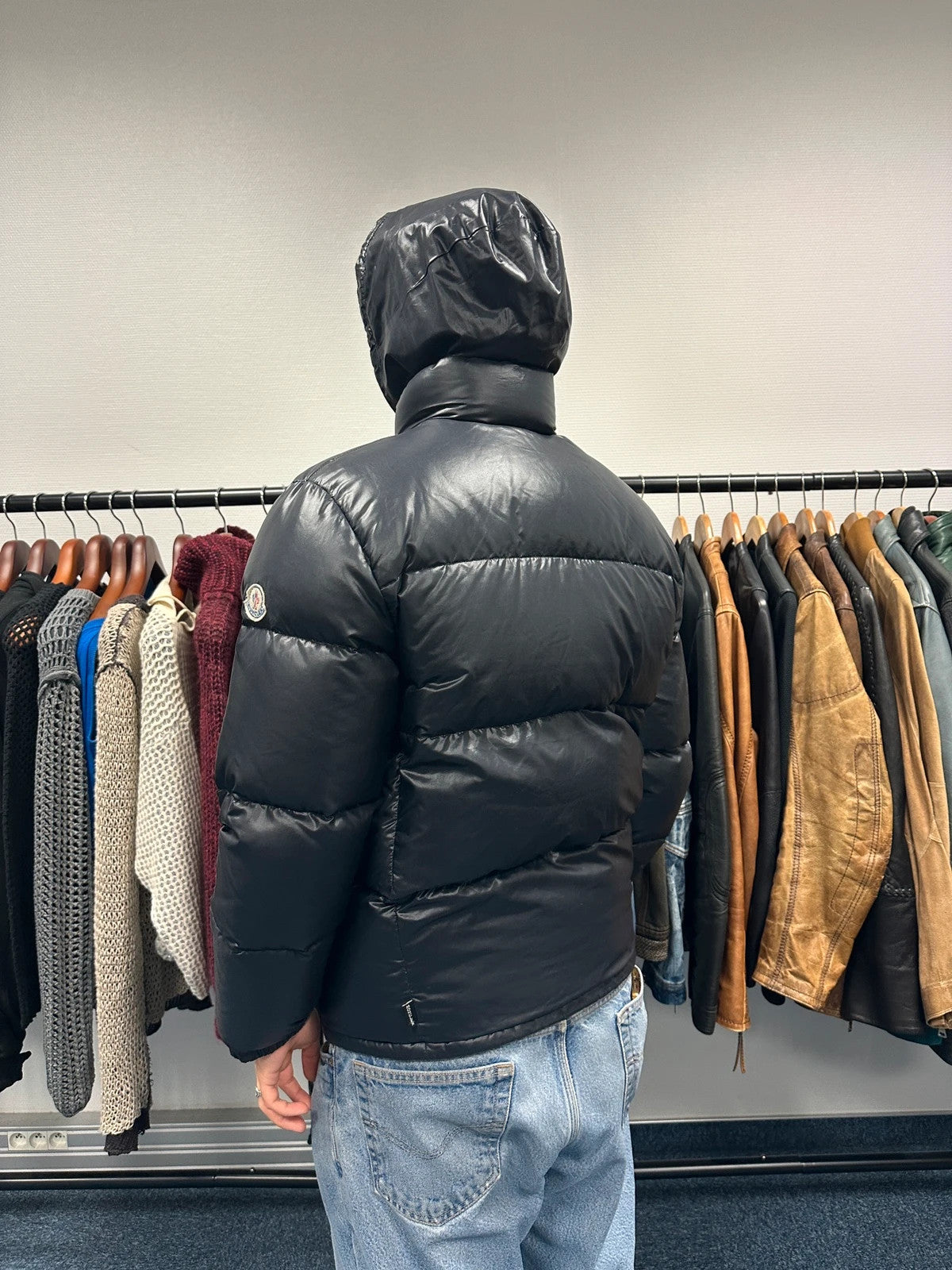 Moncler black nylon hooded puffer jacket with vintage logo and down filling.