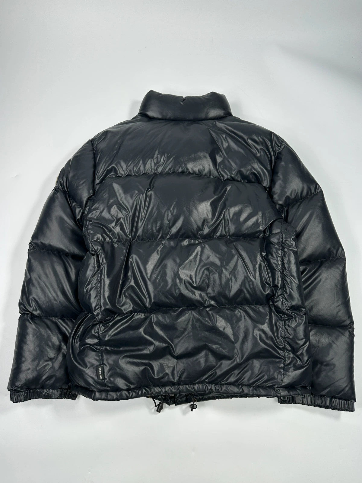 Moncler black nylon hooded puffer jacket with vintage logo and down filling.