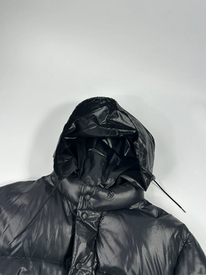 Moncler black nylon hooded puffer jacket with vintage logo and down filling.