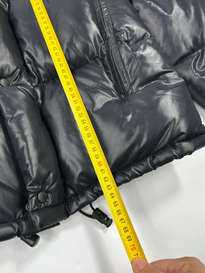 Moncler black nylon hooded puffer jacket with vintage logo and down filling.