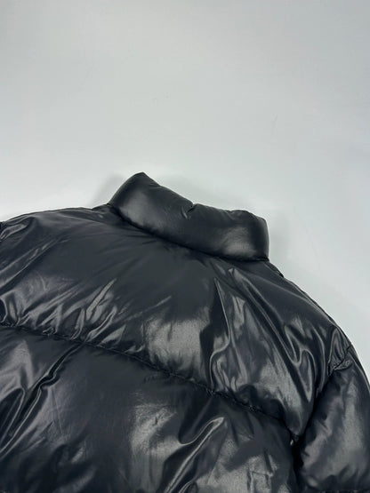 Moncler black nylon hooded puffer jacket with vintage logo and down filling.
