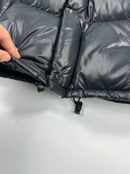 Moncler black nylon hooded puffer jacket with vintage logo and down filling.